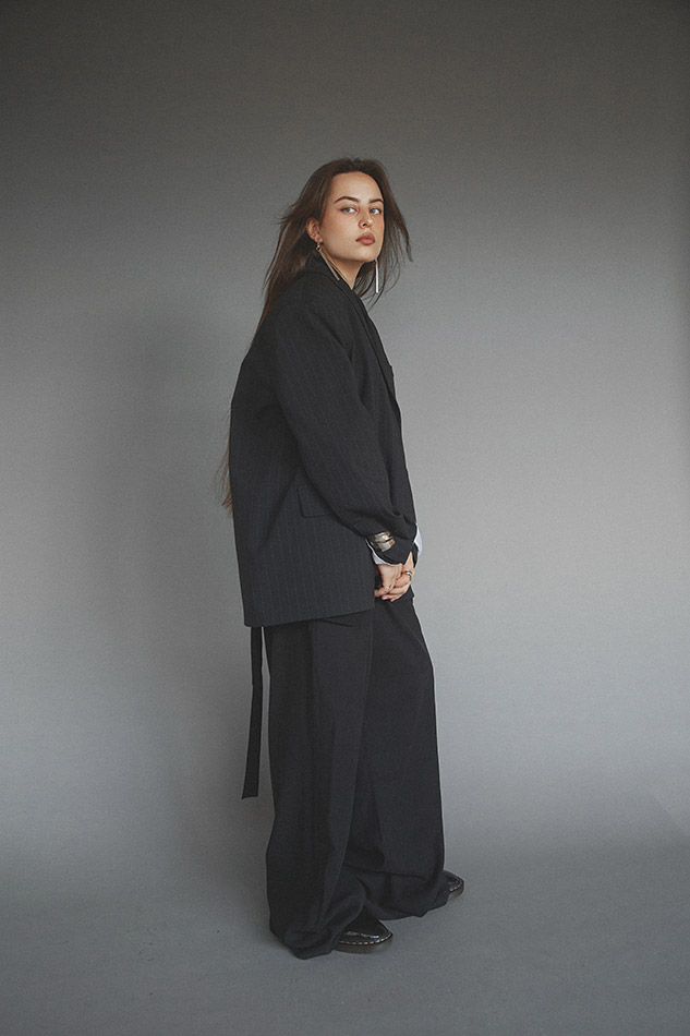 Savannah, a Brisbane and Gold Coast model from TMA, posing on the beach in a bikini during golden hour, captured by photographer Sam David.