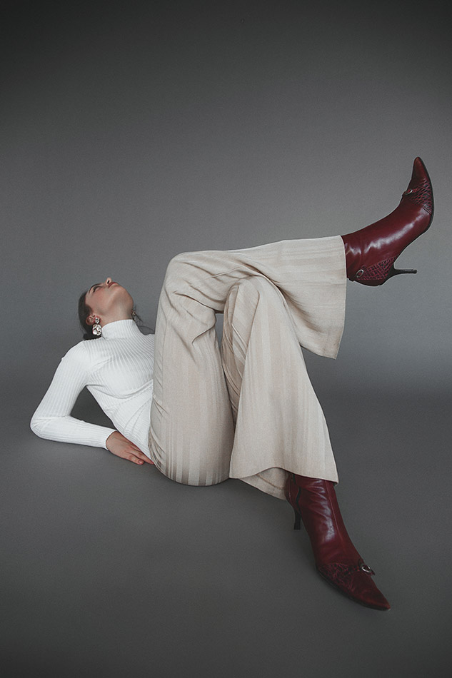 Savannah, a Brisbane and Gold Coast model from TMA, posing on the beach in a bikini during golden hour, captured by photographer Evelina Fietisova for Seamless Underwear