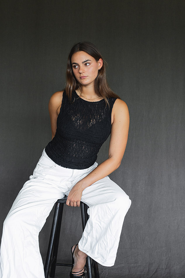 Savannah, a Brisbane and Gold Coast model from TMA, posing on the beach in a bikini during golden hour, captured by photographer Sam David.