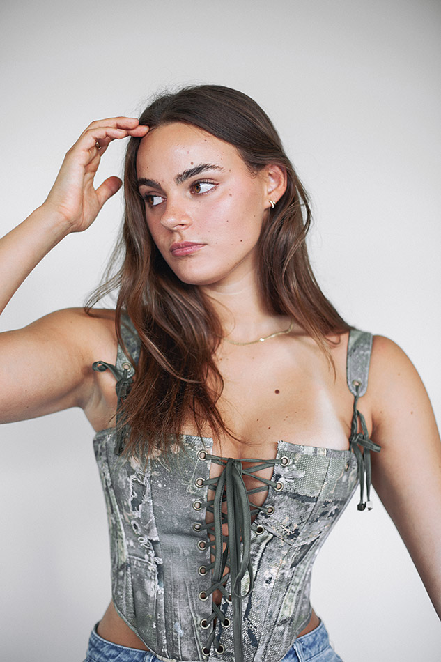 Savannah, a Brisbane and Gold Coast model from TMA, posing on the beach in a bikini during golden hour, captured by photographer Sam David.
