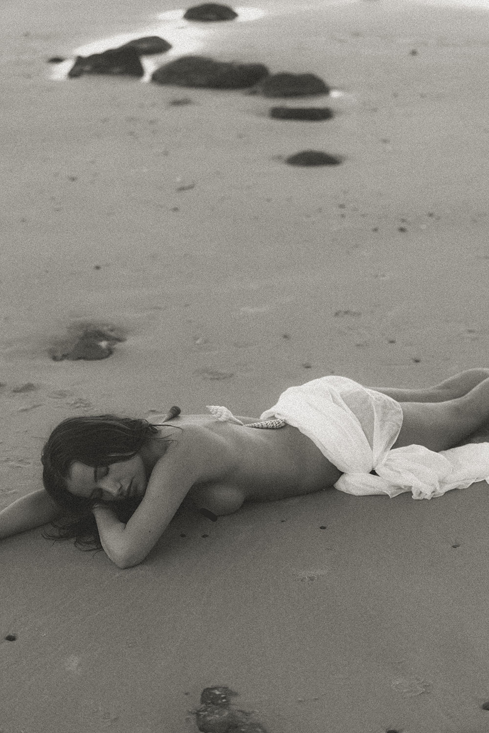 Savannah, a Brisbane and Gold Coast model from TMA, posing on the beach in a bikini during golden hour, captured by photographer Sam David.